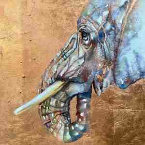 framed copper elephant on wood